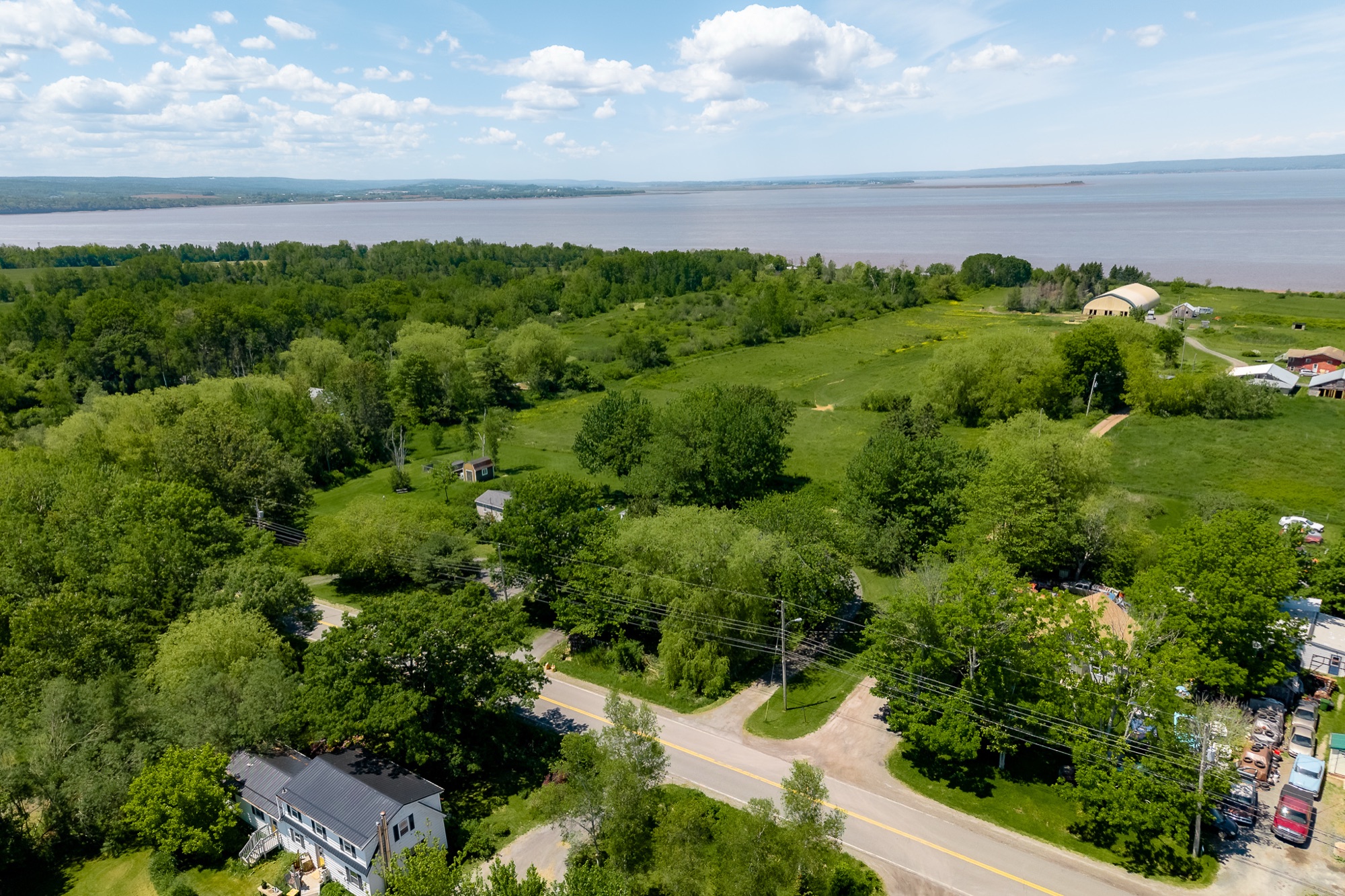 Wide aerial showing the home and surrounding countryside