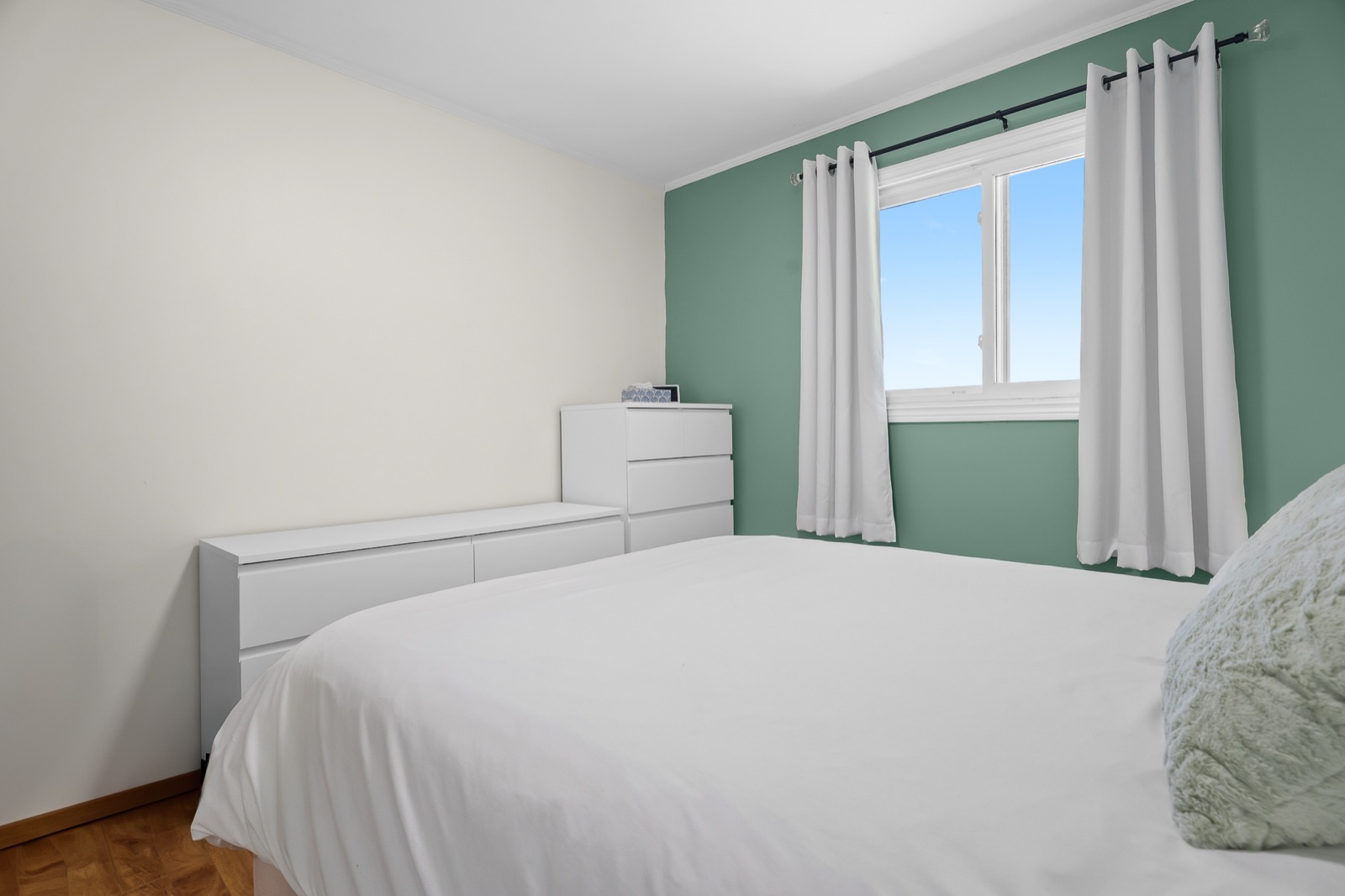 Green bedroom, second angle with white dressers