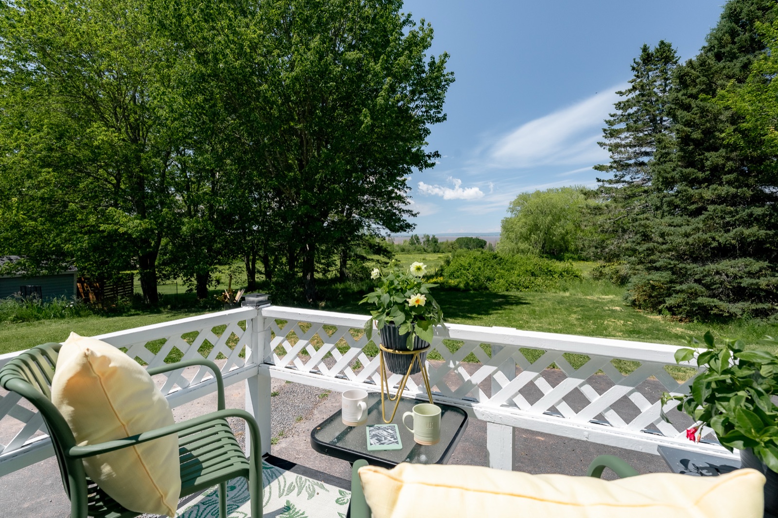 The back-deck sitting corner looking over the fields to the water