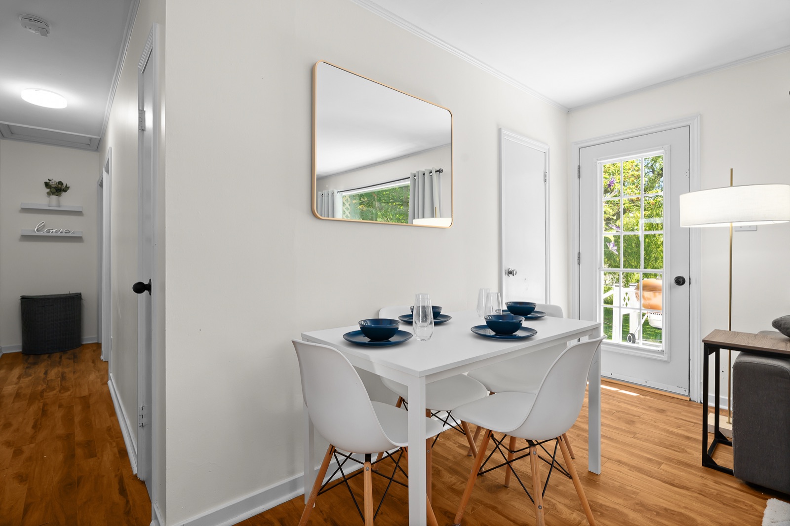 Dining table by the garden door with hallway beyond
