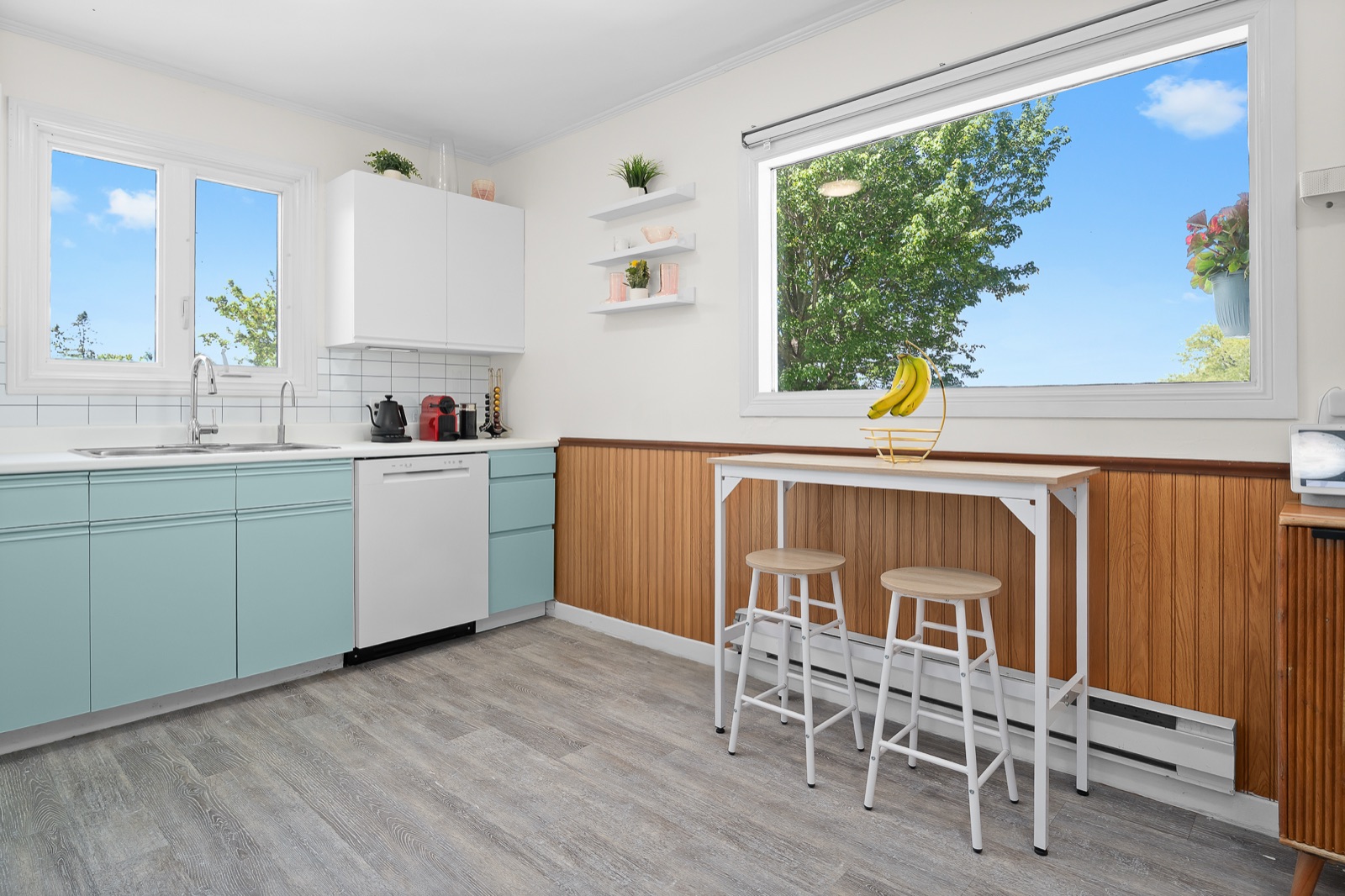 Kitchen with breakfast bar and wood wainscoting
