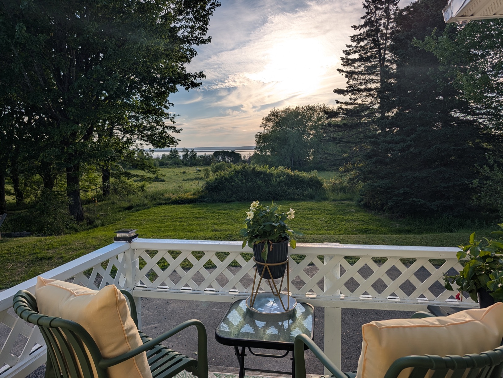 Golden-hour light over the Minas Basin, framed by the deck