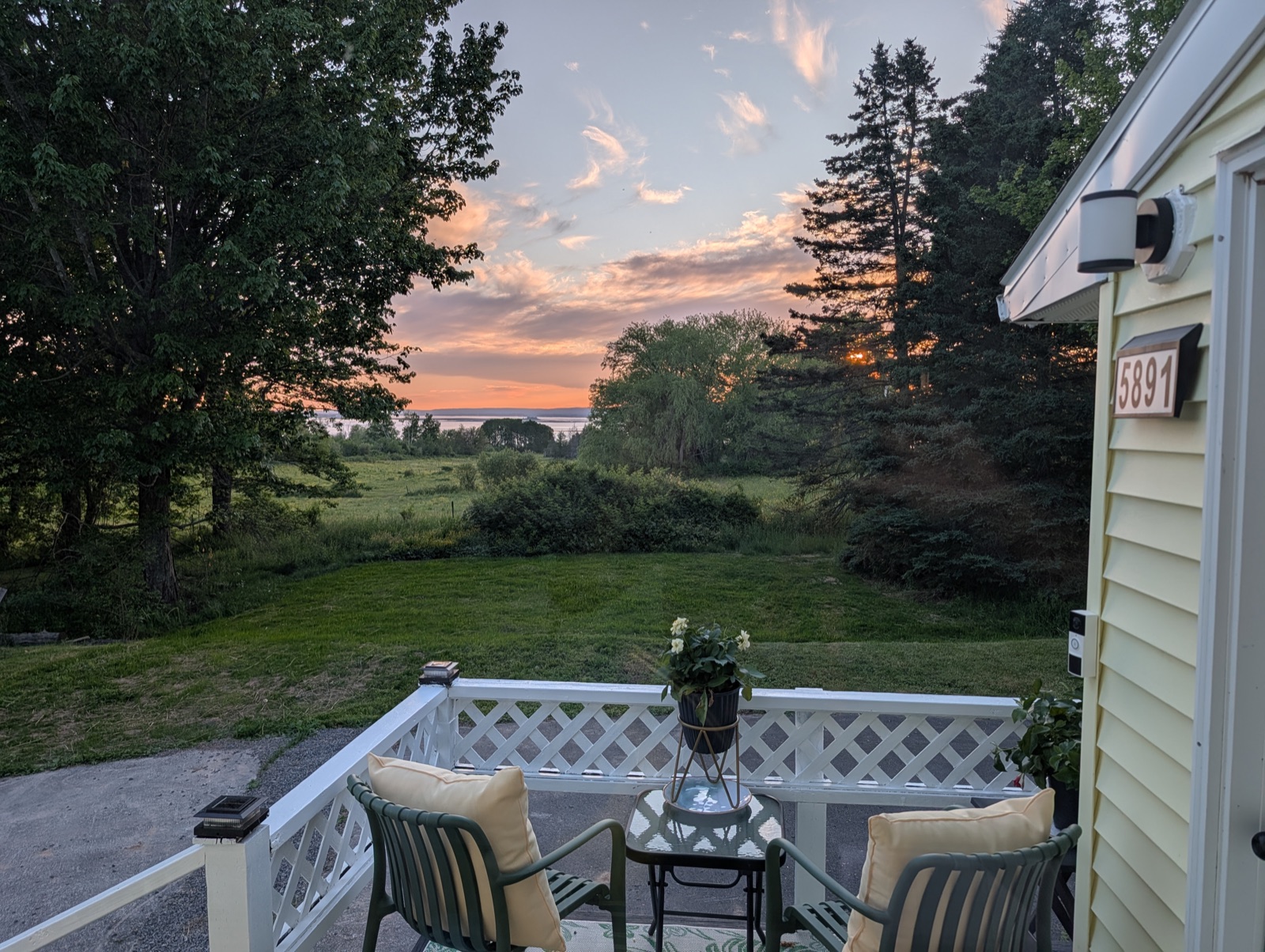 Peachy evening sky over the fields from the deck